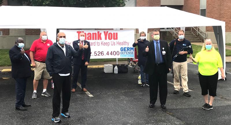 Kicking off the May 22 Oceanside Elite Cleaning and Germ Defense Delaware vehicle disinfection event are (l-r) Dr. Ray Kuretu, Greg Kushner, Dr. Ehtasham Qureshi, Tom Protack, Gretchen McKay, Brian McCarthy, Matthew McKay and Noreen Kushner in the parking lot of Shields Elementary in Lewes. SUBMITTED PHOTO